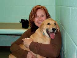 A pound puller with a dog happy to see them